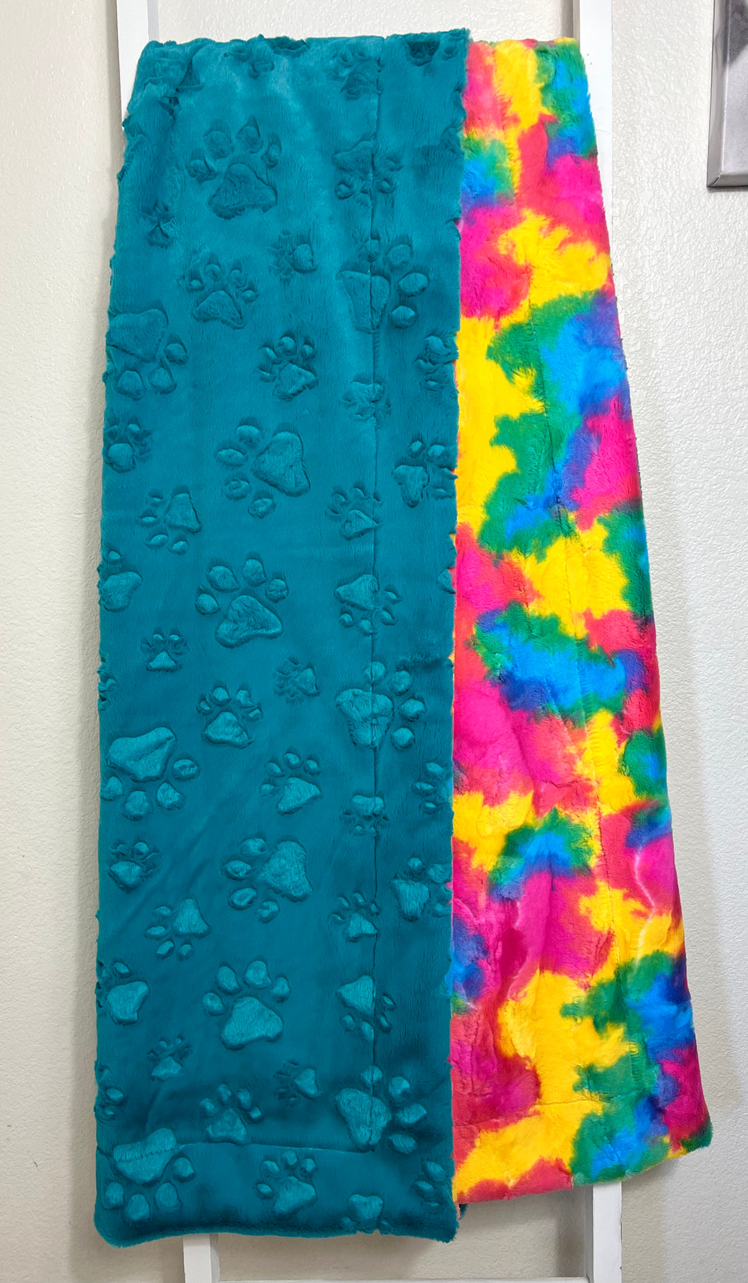 Teal embossed paws on rainbow sherbet 60x72